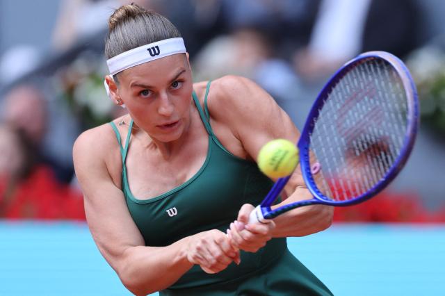 Ukraine's Marta Kostyuk returns a ball to Russia's Mirra Andreeva during the 2026 WTA Tour Madrid Open tennis tournament final singles match at the Caja Magica in Madrid, on May 2, 2026. (Photo by Thomas COEX / AFP)