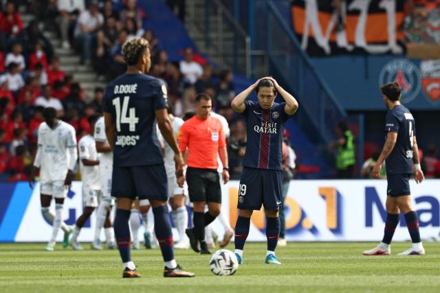 Paris Saint-Germain's South Korean midfielder #19 Kang-In Lee (C) reacts after Lorient's equalizer during the French L1 football match between Paris Saint-Germain (PSG) and FC Lorient at Parc des Princes stadium in Paris on May 2, 2026. (Photo by FRANCK FIFE / AFP)