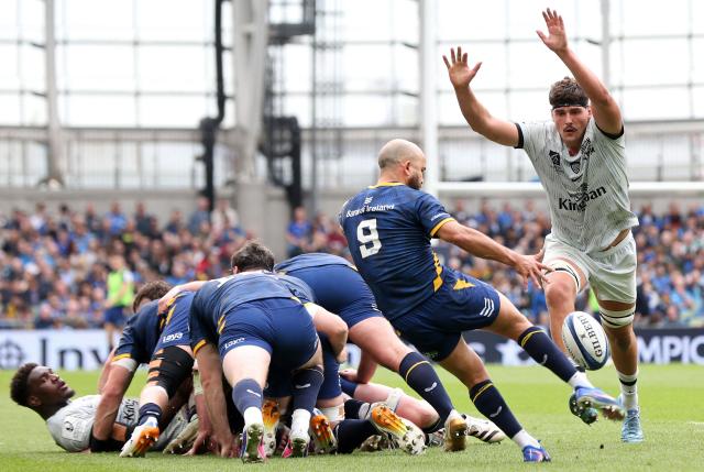 Leinster's Irish scrum-half Jamison Gibson-Park (2R) kicks under pressure from  Toulon's French lock Corentin Mezou (R) during the European Champions Cup semi-final rugby union match between Leinster and Toulon at the Aviva Stadium in Dublin, Ireland on May 2, 2026. (Photo by Paul Faith / AFP)