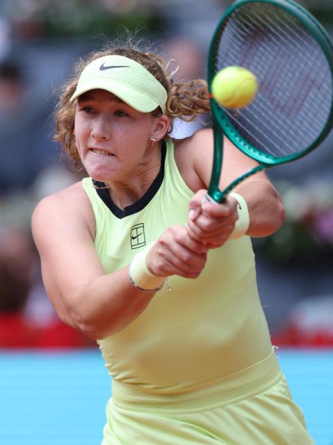 Russia's Mirra Andreeva returns a ball to Ukraine's Marta Kostyuk during the 2026 WTA Tour Madrid Open tennis tournament final singles match at the Caja Magica in Madrid, on May 2, 2026. (Photo by Thomas COEX / AFP)