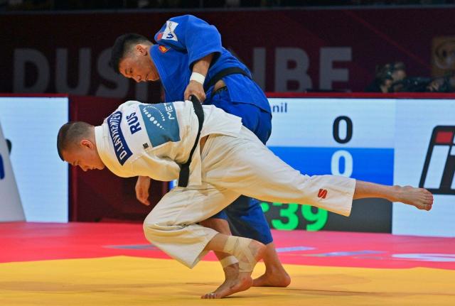 CORRECTION / Russia's Danil Lavrentiev (bottom) and Mongolia's Ankhzya Lavjargal fight during the men's -73kg judo contest bronze medal match at the Dushanbe Grand Slam judo tournament in Dushanbe on May 2, 2026. (Photo by AFP) / “The erroneous mention[s] appearing in the metadata of this photo has been modified in AFP systems in the following manner: [Byline is STRINGER] instead of [NEMENOV. Please immediately remove the erroneous mention[s] from all your online services and delete it (them) from your servers. If you have been authorized by AFP to distribute it (them) to third parties, please ensure that the same actions are carried out by them. Failure to promptly comply with these instructions will entail liability on your part for any continued or post notification usage. Therefore we thank you very much for all your attention and prompt action. We are sorry for the inconvenience this notification may cause and remain at your disposal for any further information you may require.”