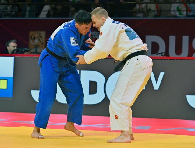 CORRECTION / Russia's Danil Lavrentiev (R) and Mongolia's Ankhzya Lavjargal fight during the men's -73kg judo contest bronze medal match at the Dushanbe Grand Slam judo tournament in Dushanbe on May 2, 2026. (Photo by AFP) / “The erroneous mention[s] appearing in the metadata of this photo has been modified in AFP systems in the following manner: [Byline is STRINGER] instead of [NEMENOV. Please immediately remove the erroneous mention[s] from all your online services and delete it (them) from your servers. If you have been authorized by AFP to distribute it (them) to third parties, please ensure that the same actions are carried out by them. Failure to promptly comply with these instructions will entail liability on your part for any continued or post notification usage. Therefore we thank you very much for all your attention and prompt action. We are sorry for the inconvenience this notification may cause and remain at your disposal for any further information you may require.”
