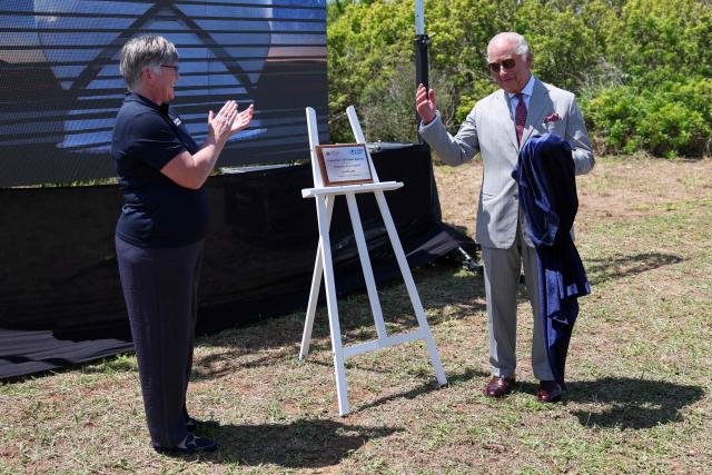 Britain's King Charles unveils a plaque to officially launch the UK Space Agency (UKSA) 'Project Nova', on Cooper's Island, Bermuda, May 2, 2026. King Charles III is in Bermuda for his first visit to a British Overseas Territory as Sovereign. (Photo by Suzanne Plunkett / POOL / AFP)