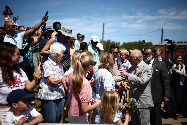 Britain's King Charles III greets members of the public at the Great Bay Coast Guard Station in St. David's, Bermuda, on May 2, 2026. King Charles III is in Bermuda for his first visit to a British Overseas Territory as Sovereign. (Photo by HENRY NICHOLLS / AFP)