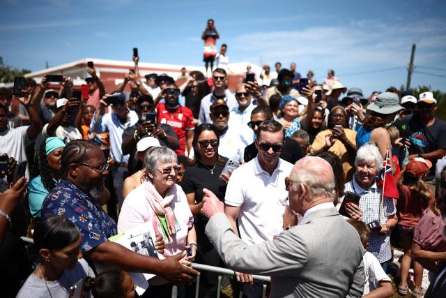 Britain's King Charles III greets members of the public during a visit at the Great Bay Coast Guard Station in St. David's, Bermuda, on May 2, 2026. King Charles III is in Bermuda for his first visit to a British Overseas Territory as Sovereign. (Photo by HENRY NICHOLLS / AFP)