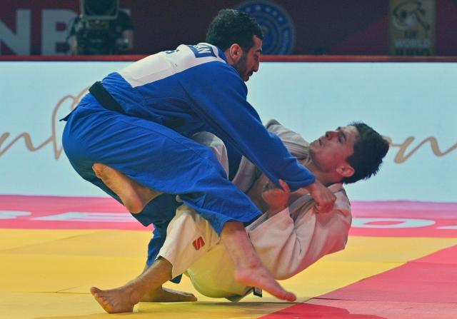 CORRECTION / Tajikistan's Muhiddin Asadulloev (R) and Russia's Karen Galstian fight during the men's -73kg final at the Dushanbe Grand Slam judo tournament in Dushanbe on May 2, 2026. (Photo by AFP) / “The erroneous mention[s] appearing in the metadata of this photo has been modified in AFP systems in the following manner: [Byline is STRINGER] instead of [NEMENOV. Please immediately remove the erroneous mention[s] from all your online services and delete it (them) from your servers. If you have been authorized by AFP to distribute it (them) to third parties, please ensure that the same actions are carried out by them. Failure to promptly comply with these instructions will entail liability on your part for any continued or post notification usage. Therefore we thank you very much for all your attention and prompt action. We are sorry for the inconvenience this notification may cause and remain at your disposal for any further information you may require.”