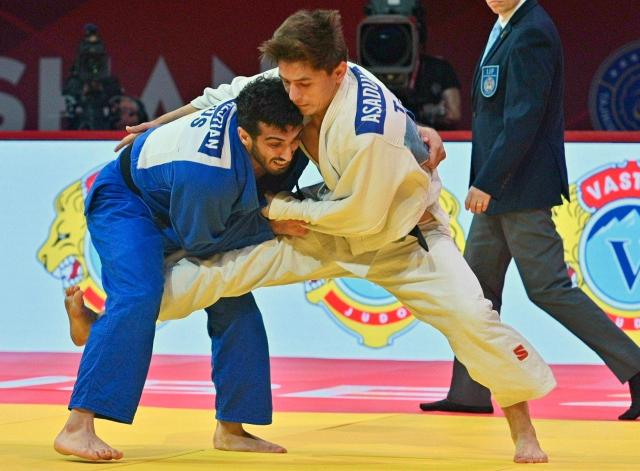 CORRECTION / Tajikistan's Muhiddin Asadulloev (R) and Russia's Karen Galstian fight during the men's -73kg final at the Dushanbe Grand Slam judo tournament in Dushanbe on May 2, 2026. (Photo by AFP) / “The erroneous mention[s] appearing in the metadata of this photo has been modified in AFP systems in the following manner: [Byline is STRINGER] instead of [NEMENOV. Please immediately remove the erroneous mention[s] from all your online services and delete it (them) from your servers. If you have been authorized by AFP to distribute it (them) to third parties, please ensure that the same actions are carried out by them. Failure to promptly comply with these instructions will entail liability on your part for any continued or post notification usage. Therefore we thank you very much for all your attention and prompt action. We are sorry for the inconvenience this notification may cause and remain at your disposal for any further information you may require.”