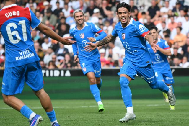 Atletico Madrid's Spanish midfielder #37 Iker Luque (R) celebrates scoring the opening goal during the Spanish league football match between Valencia CF and Club Atletico de Madrid at Mestalla Stadium in Valencia on May 2, 2026. (Photo by JOSE JORDAN / AFP)