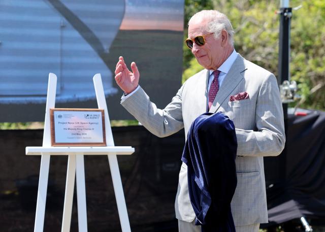Britain's King Charles III unveils a plaque to officially launch the UK Space Agency’s ‘Project Nova’ at the site of a new UK Space Agency observatory on his final day in Bermuda on Cooper's Island, Bermuda, May 2, 2026. King Charles III is in Bermuda for his first visit to a British Overseas Territory as Sovereign. (Photo by Chris Jackson / POOL / AFP)