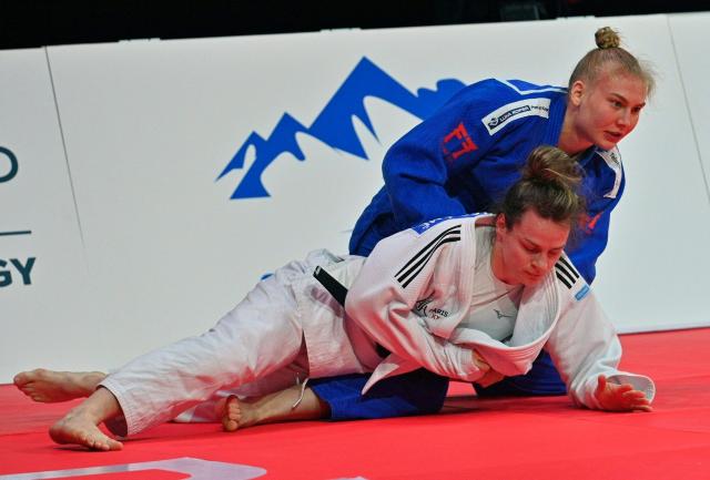 France's Clemence Eme (bottom) and Slovakia's Nika Koren fight during their women's -70kg judo contest bronze medal match at the Dushanbe Grand Slam judo tournament in Dushanbe on May 2, 2026. (Photo by AFP)