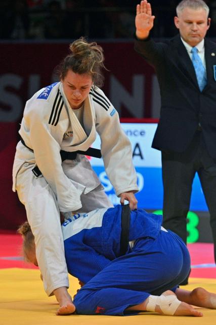 France's Clemence Eme (L) and Slovakia's Nika Koren fight during their women's -70kg judo contest bronze medal match at the Dushanbe Grand Slam judo tournament in Dushanbe on May 2, 2026. (Photo by AFP)