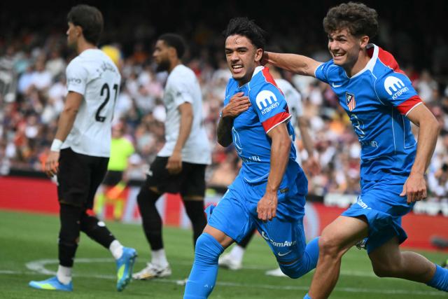 Atletico Madrid's Spanish midfielder #37 Iker Luque (C) celebrates scoring the opening goal during the Spanish league football match between Valencia CF and Club Atletico de Madrid at Mestalla Stadium in Valencia on May 2, 2026. (Photo by JOSE JORDAN / AFP)