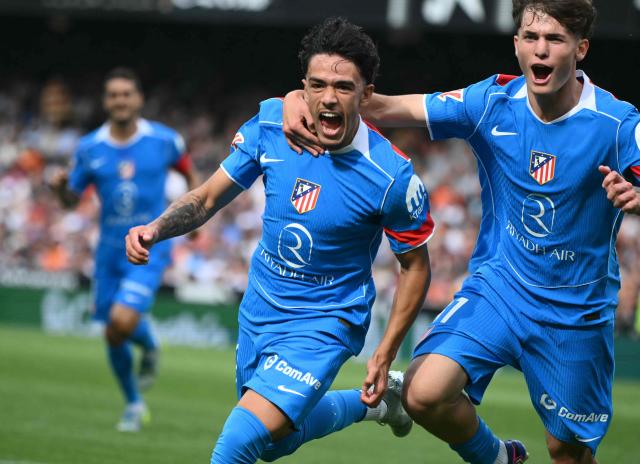 Atletico Madrid's Spanish midfielder #37 Iker Luque (L) celebrates scoring the opening goal during the Spanish league football match between Valencia CF and Club Atletico de Madrid at Mestalla Stadium in Valencia on May 2, 2026. (Photo by JOSE JORDAN / AFP)