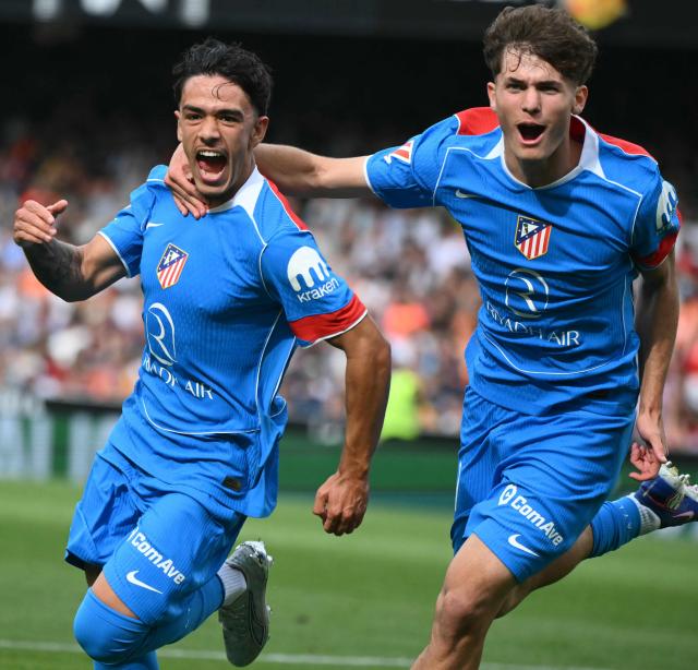 Atletico Madrid's Spanish midfielder #37 Iker Luque (L) celebrates scoring the opening goal during the Spanish league football match between Valencia CF and Club Atletico de Madrid at Mestalla Stadium in Valencia on May 2, 2026. (Photo by JOSE JORDAN / AFP)