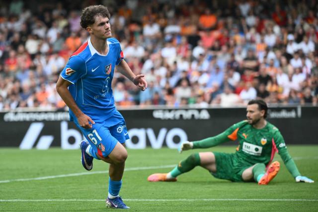 Atletico Madrid's Spanish midfielder #61 Miguel Cubo celebrates scoring his team's second goal during the Spanish league football match between Valencia CF and Club Atletico de Madrid at Mestalla Stadium in Valencia on May 2, 2026. (Photo by JOSE JORDAN / AFP)