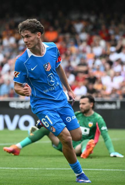 Atletico Madrid's Spanish midfielder #61 Miguel Cubo celebrates scoring his team's second goal during the Spanish league football match between Valencia CF and Club Atletico de Madrid at Mestalla Stadium in Valencia on May 2, 2026. (Photo by JOSE JORDAN / AFP)