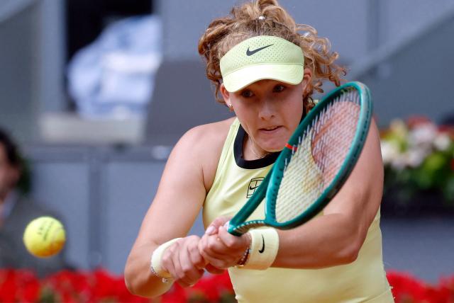 Russia's Mirra Andreeva returns a ball to Ukraine's Marta Kostyuk during the 2026 WTA Tour Madrid Open tennis tournament final singles match at the Caja Magica in Madrid, on May 2, 2026. (Photo by Oscar DEL POZO / AFP)