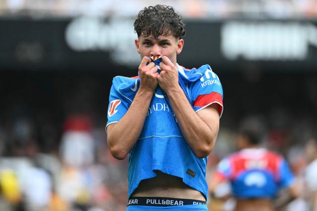 Atletico Madrid's Spanish midfielder #61 Miguel Cubo celebrates scoring his team's second goal during the Spanish league football match between Valencia CF and Club Atletico de Madrid at Mestalla Stadium in Valencia on May 2, 2026. (Photo by JOSE JORDAN / AFP)