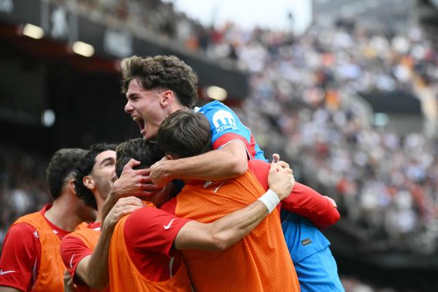 Atletico Madrid's Spanish midfielder #61 Miguel Cubo (TOP) celebrates scoring his team's second goal during the Spanish league football match between Valencia CF and Club Atletico de Madrid at Mestalla Stadium in Valencia on May 2, 2026. (Photo by JOSE JORDAN / AFP)