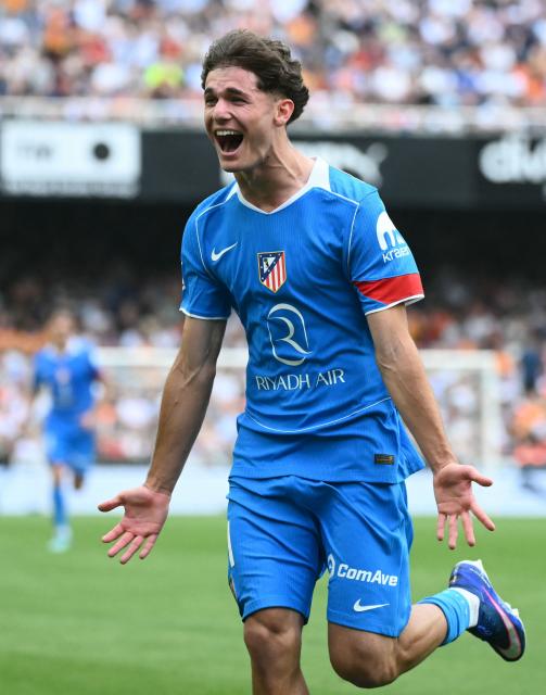 Atletico Madrid's Spanish midfielder #61 Miguel Cubo celebrates scoring his team's second goal during the Spanish league football match between Valencia CF and Club Atletico de Madrid at Mestalla Stadium in Valencia on May 2, 2026. (Photo by JOSE JORDAN / AFP)