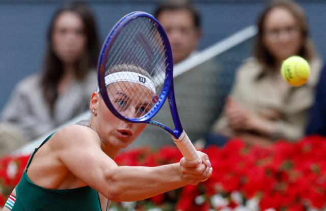 Ukraine's Marta Kostyuk returns a ball to Russia's Mirra Andreeva during the 2026 WTA Tour Madrid Open tennis tournament final singles match at the Caja Magica in Madrid, on May 2, 2026. (Photo by Oscar DEL POZO / AFP)