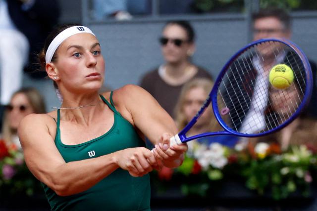 Ukraine's Marta Kostyuk returns the ball to Russia's Mirra Andreeva during the 2026 WTA Tour Madrid Open tennis tournament final singles match at the Caja Magica in Madrid, on May 2, 2026. (Photo by Oscar DEL POZO / AFP)
