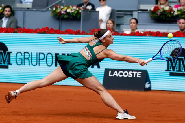 Ukraine's Marta Kostyuk returns the ball to Russia's Mirra Andreeva during the 2026 WTA Tour Madrid Open tennis tournament final singles match at the Caja Magica in Madrid, on May 2, 2026. (Photo by Oscar DEL POZO / AFP)