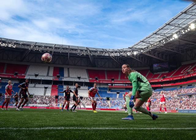 Arsenal’s Dutch goalkeeper #14 Daphne van Domselaar (R) watches the ball during the women’s UEFA Champions League second-leg semi-final football match between OL Lyonnes and Arsenal at the Groupama Stadium, in Decines-Charpieu, central-eastern France on May 2, 2026. (Photo by OLIVIER CHASSIGNOLE / AFP)