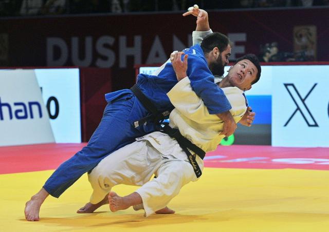 Kazakhstan's Askar Narkulov (R) and Moldova's Victor Sterpu (L) fight during their men's -81kg category bronze medal match at the Dushanbe Grand Slam judo tournament in Dushanbe on May 2, 2026. (Photo by AFP)