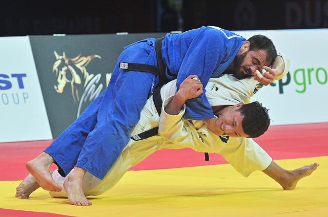 Kazakhstan's Askar Narkulov (R) and Moldova's Victor Sterpu (L) fight during their men's -81kg category bronze medal match at the Dushanbe Grand Slam judo tournament in Dushanbe on May 2, 2026. (Photo by AFP)
