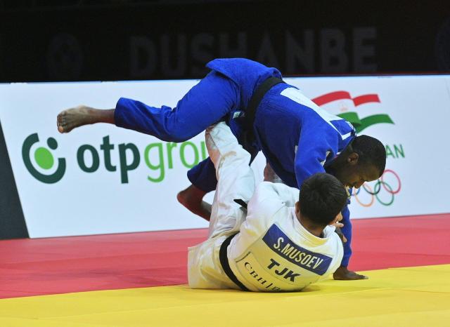 Tajikistan's Suatullo Musoev (down) and France's Alpha Oumar Djalo fight during their men's -81kg category bronze medal match at the Dushanbe Grand Slam judo tournament in Dushanbe on May 2, 2026. (Photo by AFP)