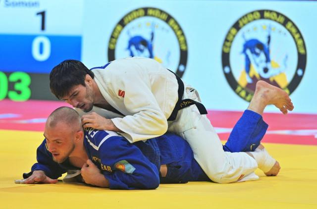 Tajikistan's Somon Makhmadbekov (R) and Austria's Bernd Fasching fight during the men's -81kg category gold medal match at the Dushanbe Grand Slam judo tournament in Dushanbe on May 2, 2026. (Photo by AFP)