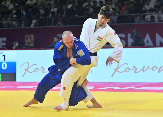 Tajikistan's Somon Makhmadbekov (R) and Austria's Bernd Fasching fight during the men's -81kg category gold medal match at the Dushanbe Grand Slam judo tournament in Dushanbe on May 2, 2026. (Photo by AFP)