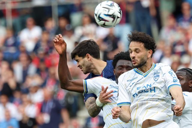 Lorient's Tunisian defender #03 Montassar Talbi (R) heads the ball during the French L1 football match between Paris Saint-Germain (PSG) and FC Lorient at Parc des Princes stadium in Paris on May 2, 2026. (Photo by FRANCK FIFE / AFP)