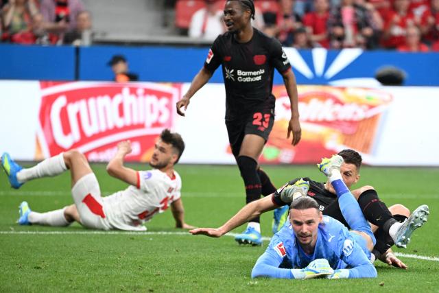 Bayer Leverkusen's Czech forward #14 Patrik Schick (R) reacts after scoring the 1-0 during the German first division Bundesliga football match between Bayer 04 Leverkusen and RB Leipzig in Leverkusen, western Germany, on May 2, 2026. (Photo by UWE KRAFT / AFP) / DFL REGULATIONS PROHIBIT ANY USE OF PHOTOGRAPHS AS IMAGE SEQUENCES AND/OR QUASI-VIDEO
