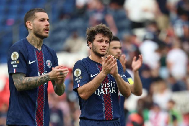 Paris Saint-Germain's French defender #21 Lucas Hernandez (L) and Portuguese midfielder #87 Joao Neves (R) react at the end of the French L1 football match between Paris Saint-Germain (PSG) and FC Lorient at Parc des Princes stadium in Paris on May 2, 2026. (Photo by FRANCK FIFE / AFP)