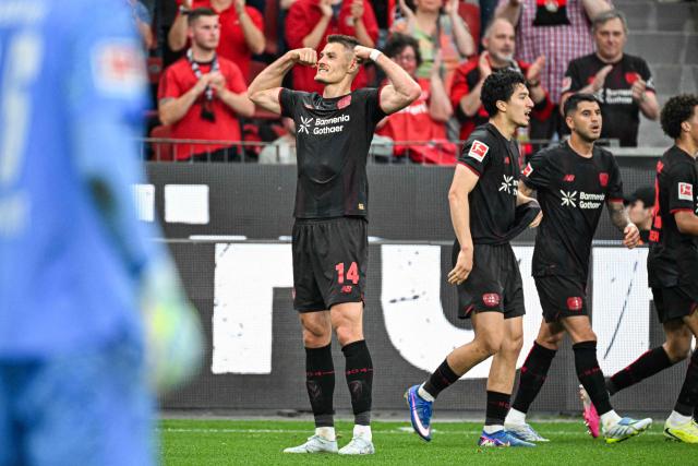 Bayer Leverkusen's Czech forward #14 Patrik Schick (C) celebrates his 1-0 during the German first division Bundesliga football match between Bayer 04 Leverkusen and RB Leipzig in Leverkusen, western Germany, on May 2, 2026. (Photo by UWE KRAFT / AFP) / DFL REGULATIONS PROHIBIT ANY USE OF PHOTOGRAPHS AS IMAGE SEQUENCES AND/OR QUASI-VIDEO