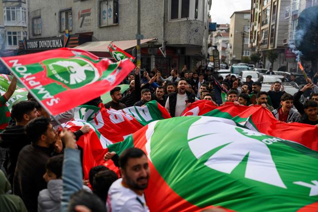 Amedspor fans celebrate their team's promotion to the Turkcell Super League, in Istanbul, on May 2, 2026. Amedspor, a club from Diyarbakir, the "capital" of Turkey's predominantly Kurdish southeast, was promoted to the Turkcell Super League after their 3-3  against Igdirspor. (Photo by Yasin AKGUL / AFP)