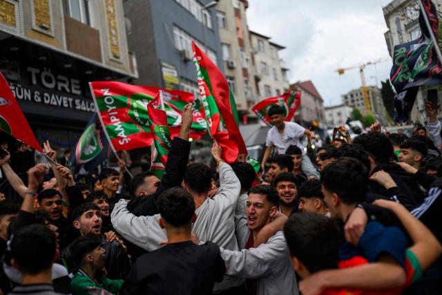 Amedspor fans celebrate their team's promotion to the Turkcell Super League, in Istanbul, on May 2, 2026. Amedspor, a club from Diyarbakir, the "capital" of Turkey's predominantly Kurdish southeast, was promoted to the Turkcell Super League after their 3-3  against Igdirspor. (Photo by Yasin AKGUL / AFP)