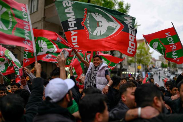 Amedspor fans celebrate their team's promotion to the Turkcell Super League, in Istanbul, on May 2, 2026. Amedspor, a club from Diyarbakir, the "capital" of Turkey's predominantly Kurdish southeast, was promoted to the Turkcell Super League after their 3-3  against Igdirspor. (Photo by Yasin AKGUL / AFP)