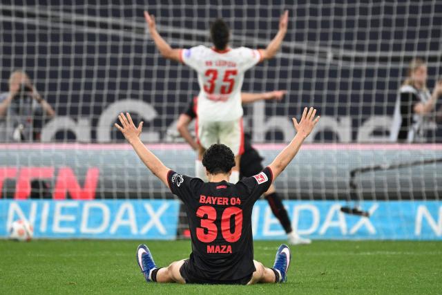 Bayer Leverkusen's Algerian midfielder #30 Ibrahim Maza (front) and Leipzig's German defender #35 Max Finkgrafe reacts after the 3-0 goal during the German first division Bundesliga football match between Bayer 04 Leverkusen and RB Leipzig in Leverkusen, western Germany, on May 2, 2026. (Photo by UWE KRAFT / AFP) / DFL REGULATIONS PROHIBIT ANY USE OF PHOTOGRAPHS AS IMAGE SEQUENCES AND/OR QUASI-VIDEO  ALTERNATIVE CROP