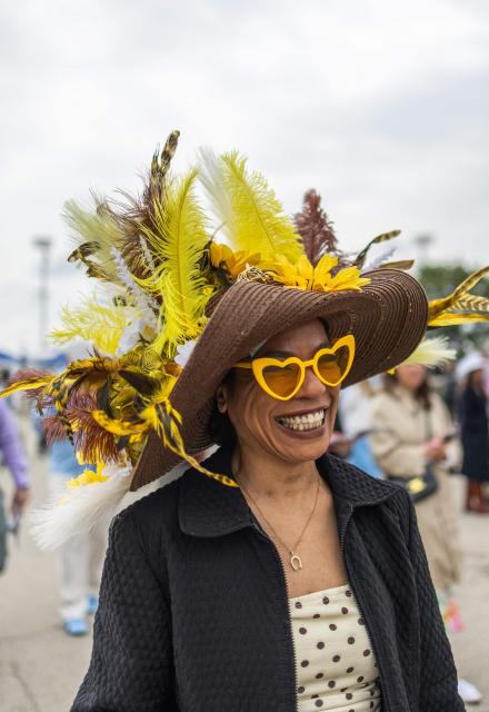An attendee arrives to the 152nd running of the Kentucky Derby at Churchill Downs in Louisville, Kentucky, on May 2, 2026. (Photo by Leandro Lozada / AFP)