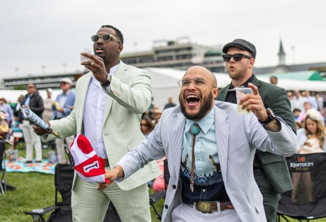 Attendees cheer during a prep race prior to the 152nd running of the Kentucky Derby at Churchill Downs in Louisville, Kentucky, on May 2, 2026. (Photo by Leandro Lozada / AFP)