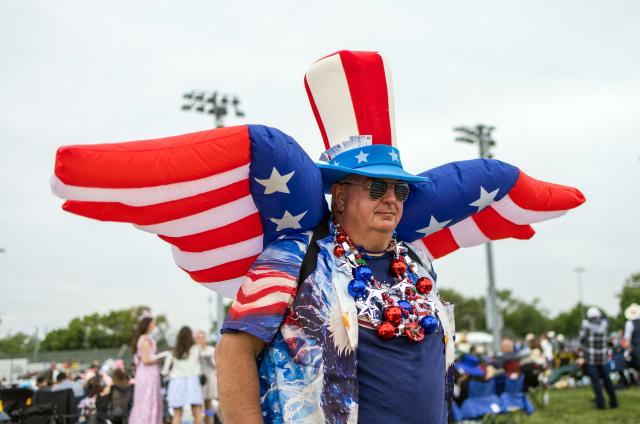 An attendee arrives to the 152nd running of the Kentucky Derby at Churchill Downs in Louisville, Kentucky, on May 2, 2026. (Photo by Leandro Lozada / AFP)