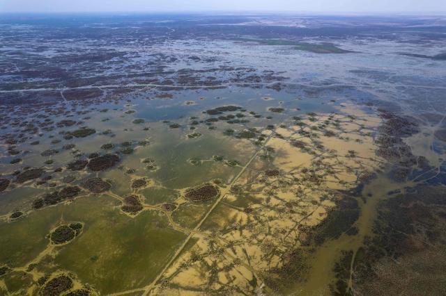 An aerial photograph shows the al-Chibayish Marches following recent rains, near the town of Al-Chibayish close to the Euphrates River in Dhi Qar governorate, southern Iraq on May 2, 2026. The Al-Chibayish Marshes are part of the larger Mesopotamian Marshes system between the Tigris and Euphrates rivers, and the largest wetlands in Southwest Asia. They are important wetlands for migratory birds, endemic birds, fish, and buffalo breeding and also home to the March Arabs. (Photo by Assad NIYAZI / AFP)