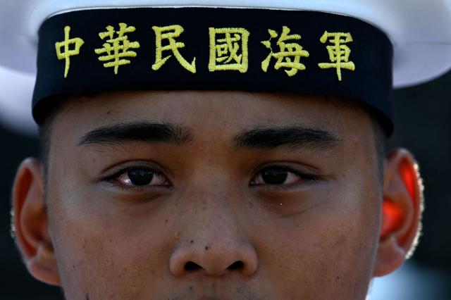 A member of the Taiwanese navy takes part in a ceremony after three Taiwanese Navy warships arrived at Puerto Quetzal, Guatemala on May 2, 2026, as part of a naval squadron. The three vessels -- described as being on a training mission -- powered into Puerto Quetzal, a port town on Guatemala's Pacific coast, in a visit "to strengthen the ties of friendship," Guatemalan officials and Taiwanese diplomats said. (Photo by Johan ORDONEZ / AFP)
