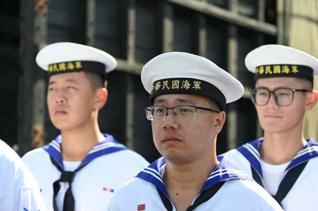 Members of the Taiwanese navy take part in a ceremony after three Taiwanese Navy warships arrived at Puerto Quetzal, Guatemala on May 2, 2026, as part of a naval squadron. The three vessels -- described as being on a training mission -- powered into Puerto Quetzal, a port town on Guatemala's Pacific coast, in a visit "to strengthen the ties of friendship," Guatemalan officials and Taiwanese diplomats said. (Photo by Johan ORDONEZ / AFP)