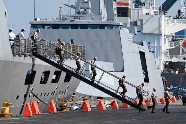 Members of the Taiwanese navy get off one of three Taiwanese Navy warships after their arrival at Puerto Quetzal, Guatemala on May 2, 2026, as part of a naval squadron. The three vessels -- described as being on a training mission -- powered into Puerto Quetzal, a port town on Guatemala's Pacific coast, in a visit "to strengthen the ties of friendship," Guatemalan officials and Taiwanese diplomats said. (Photo by Johan ORDONEZ / AFP)