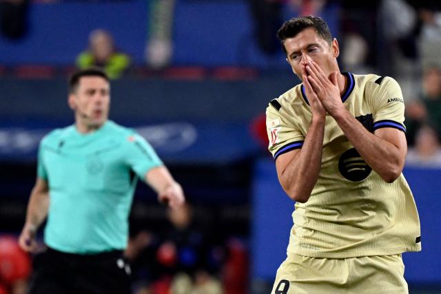 Barcelona's Polish forward #09 Robert Lewandowski reacts to missing a goal opportunity during the Spanish league football match between CA Osasuna and FC Barcelona at El Sadar Stadium in Pamplona on May 2, 2026. (Photo by ANDER GILLENEA / AFP)