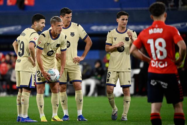 Barcelona's Spanish midfielder #20 Daniel Olmo takes the ball prior to taking a free-kick during the Spanish league football match between CA Osasuna and FC Barcelona at El Sadar Stadium in Pamplona on May 2, 2026. (Photo by ANDER GILLENEA / AFP)